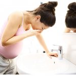 pregnant woman feels sick and vomits