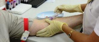 doctor takes blood from a vein